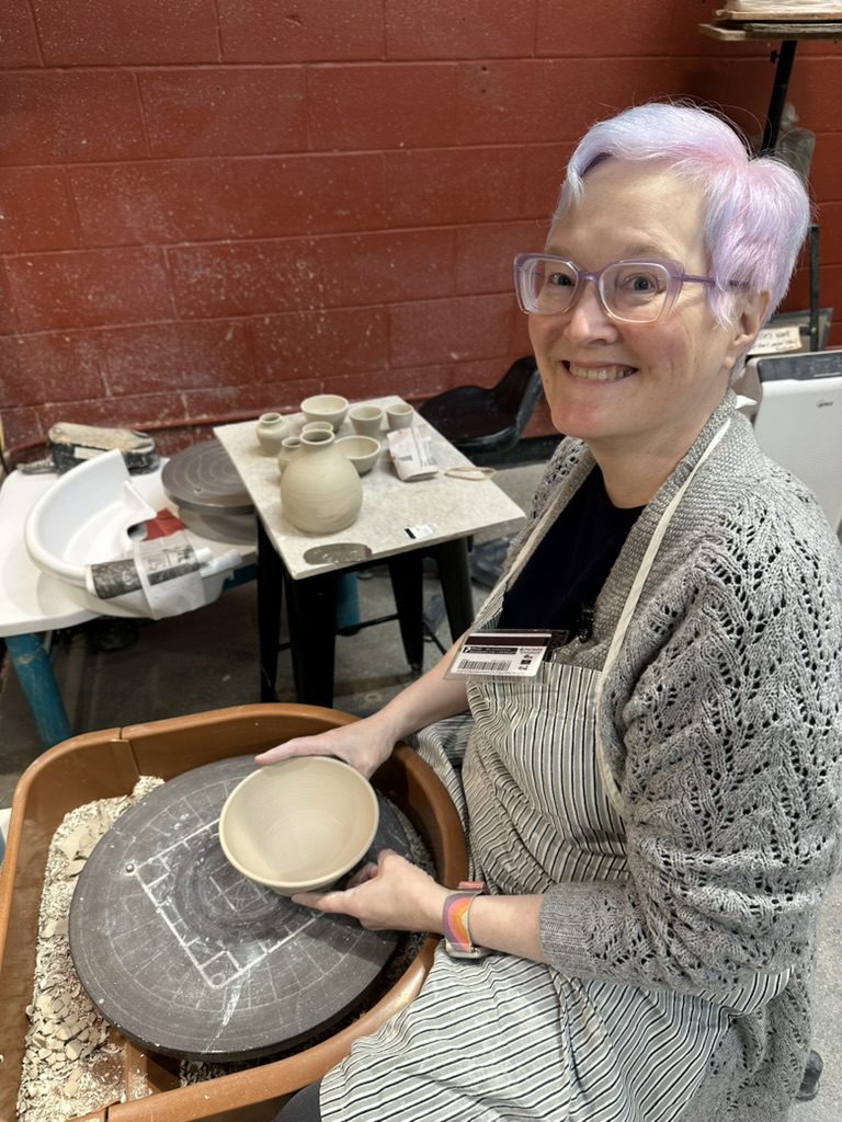 Student at the pottery wheel.